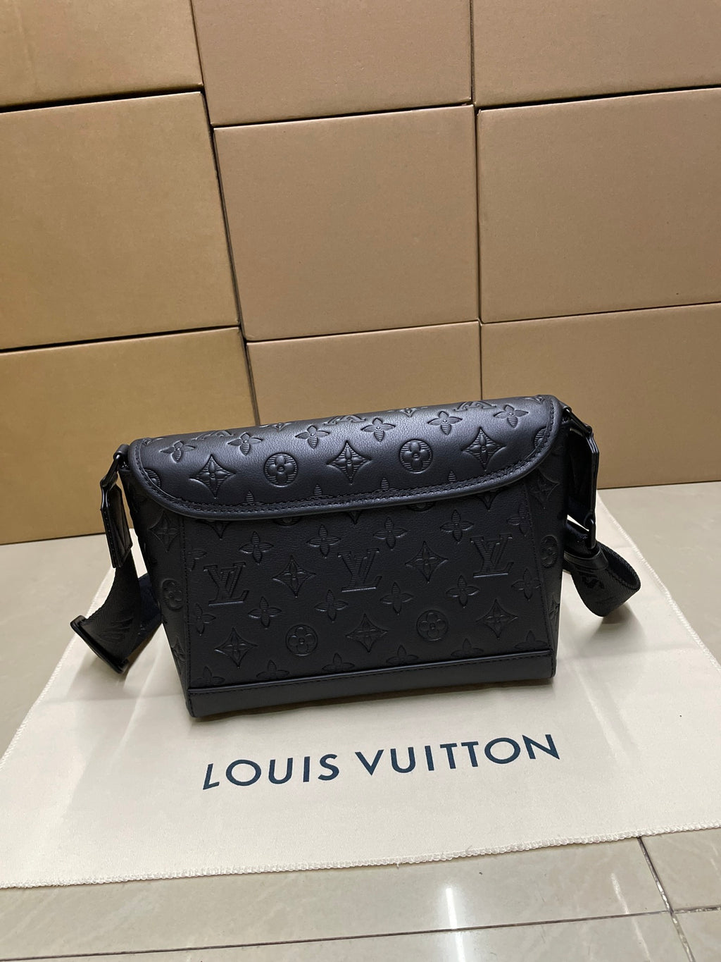 Men's Louis Vuitton monogram messenger bag, dark navy with front flap and shoulder strap