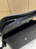 Louis Vuitton dark monogram crossbody bag interior view with zipper and logo patch