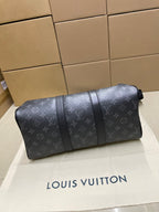 Monogram duffel bag side profile with segmented leather trim and top zipper
