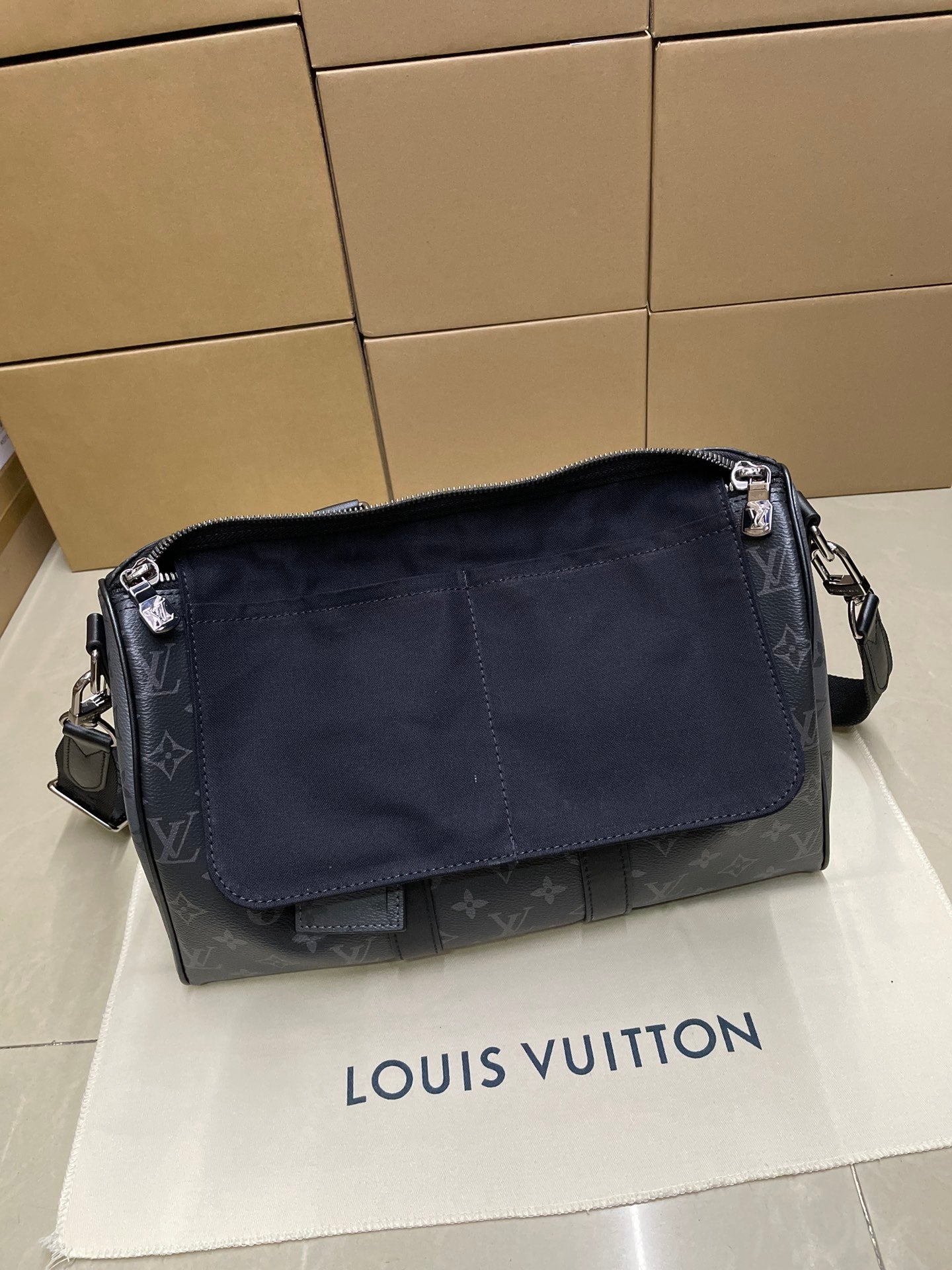 Louis Vuitton monogram crossbody bag with front flap pocket and shoulder strap, dark blue