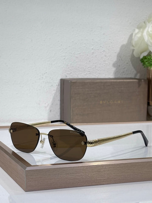 Metal-framed oval sunglasses with brown lenses and textured gold temples