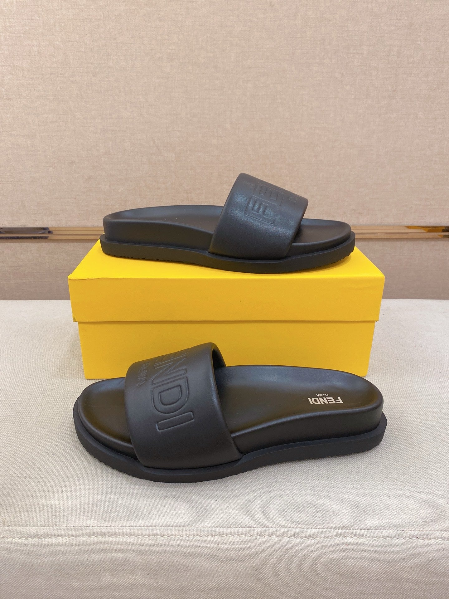 Fendi slide sandals in dark blue, top view with wide strap and logo