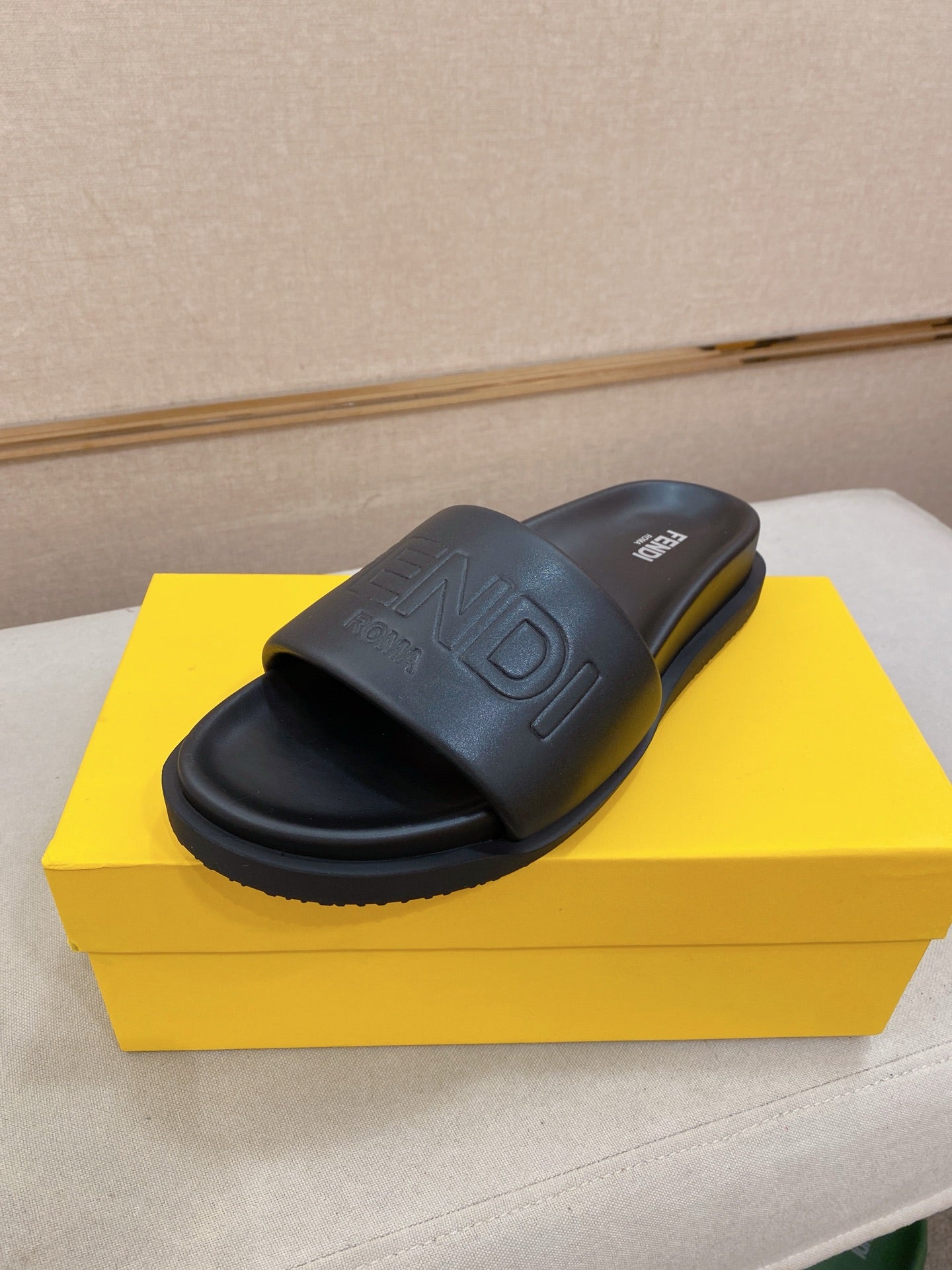 Fendi slide sandals in dark blue with embossed FF logo on wide strap