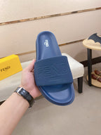 Fendi slide sandals, blue, with embossed FENDI logo on front strap and footbed