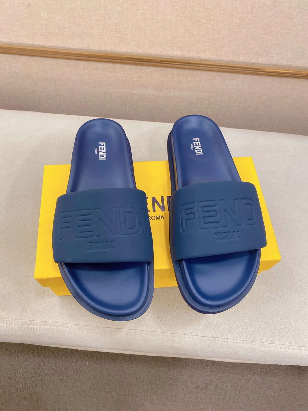 Fendi slide sandals, blue, with embossed FENDI logo on front and heel strap