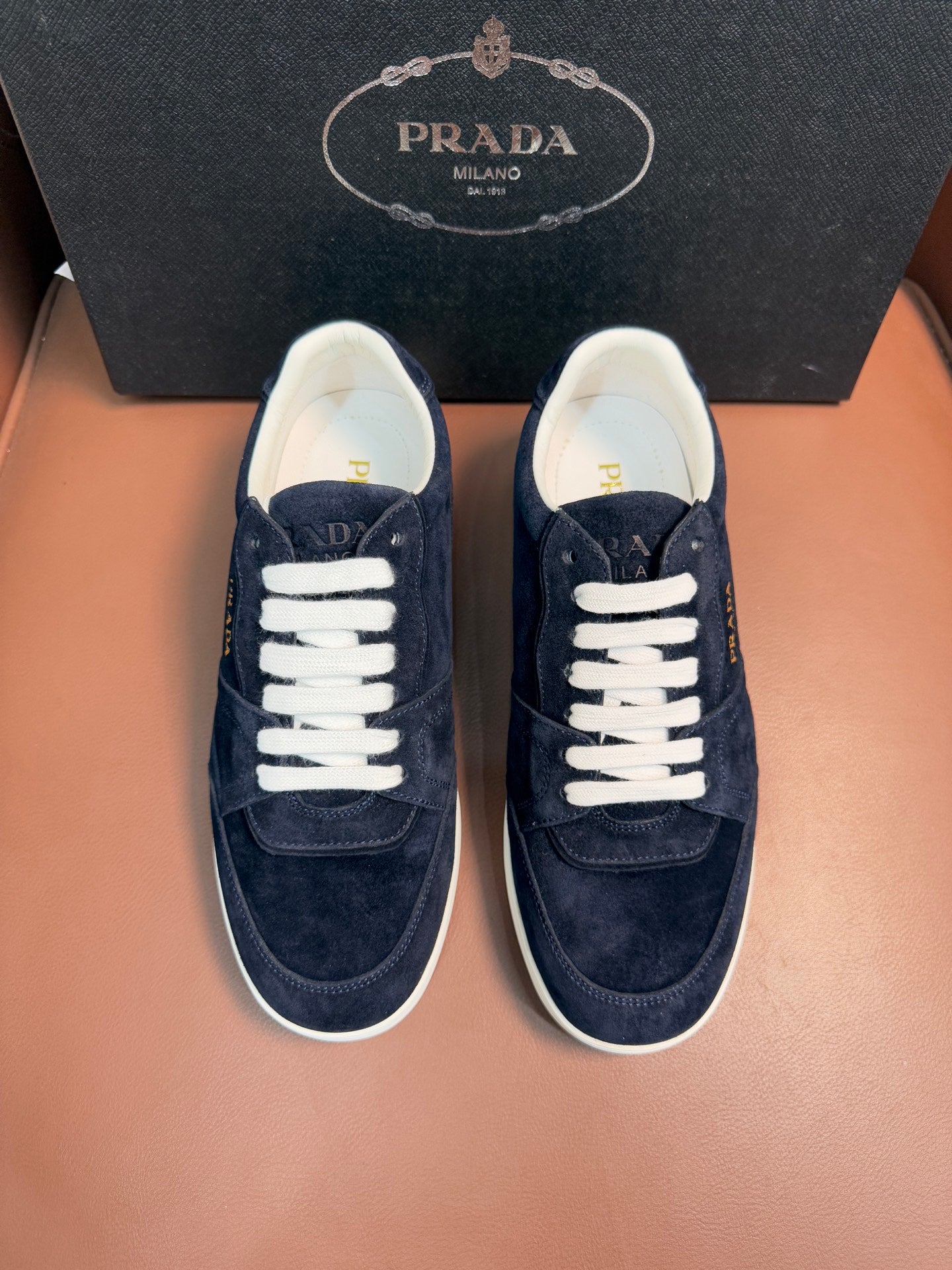 Prada unisex sneakers, dark navy suede with white laces and low-profile sole