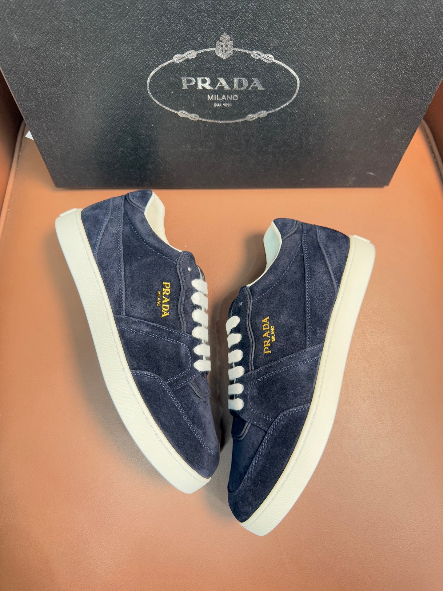 Prada unisex sneakers, navy suede pair with white laces and contrast sole