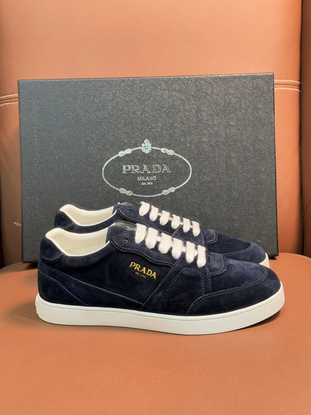 Prada unisex sneakers, navy suede with white laces and off-white rubber sole