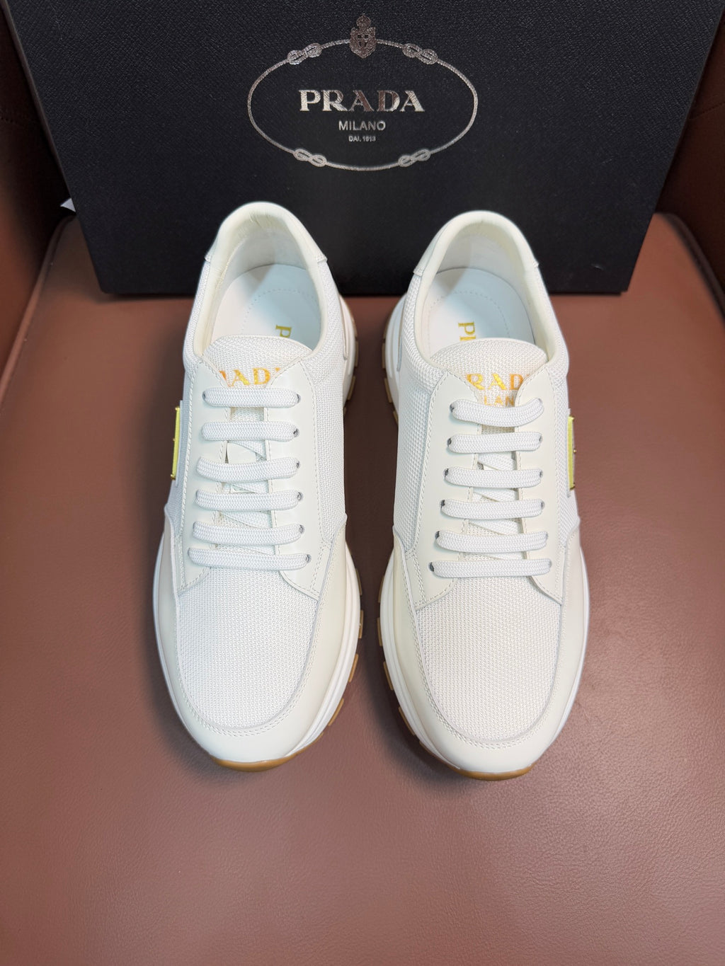 Prada unisex white sneakers, lace-up front with small triangle logo