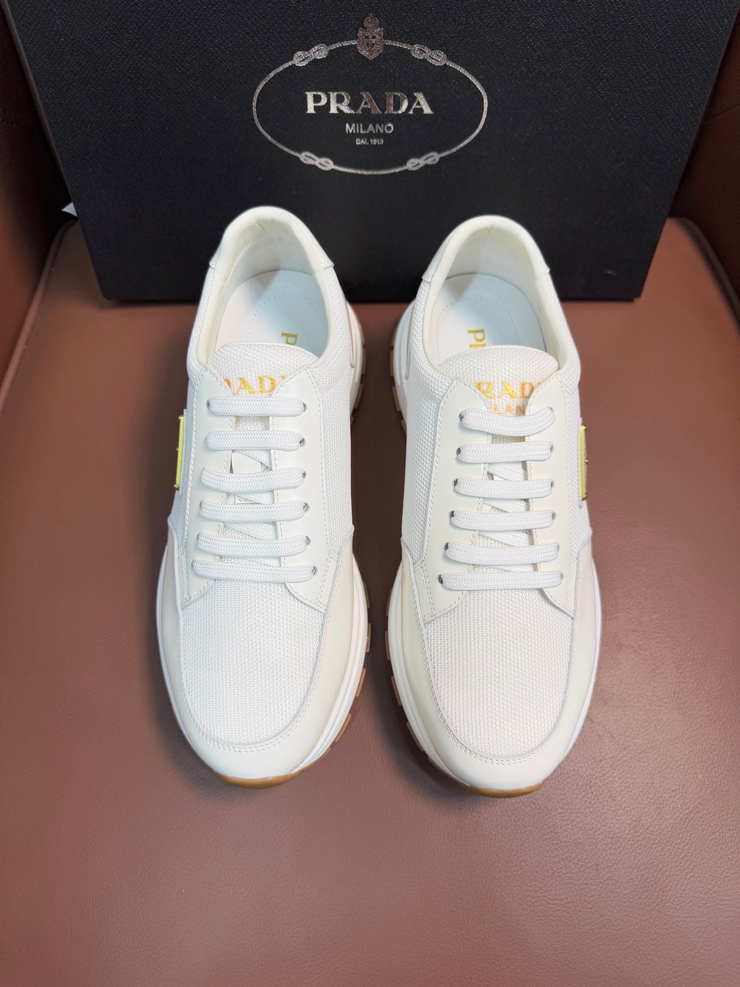 Prada unisex white sneakers, lace-up front with small triangle logo