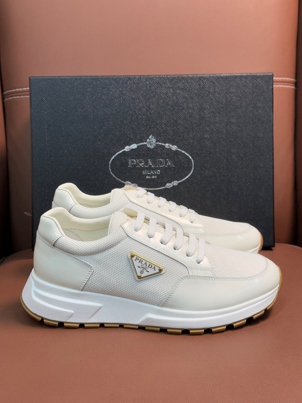 Prada unisex white sneakers, low-profile lace-up with triangle emblem and gum sole