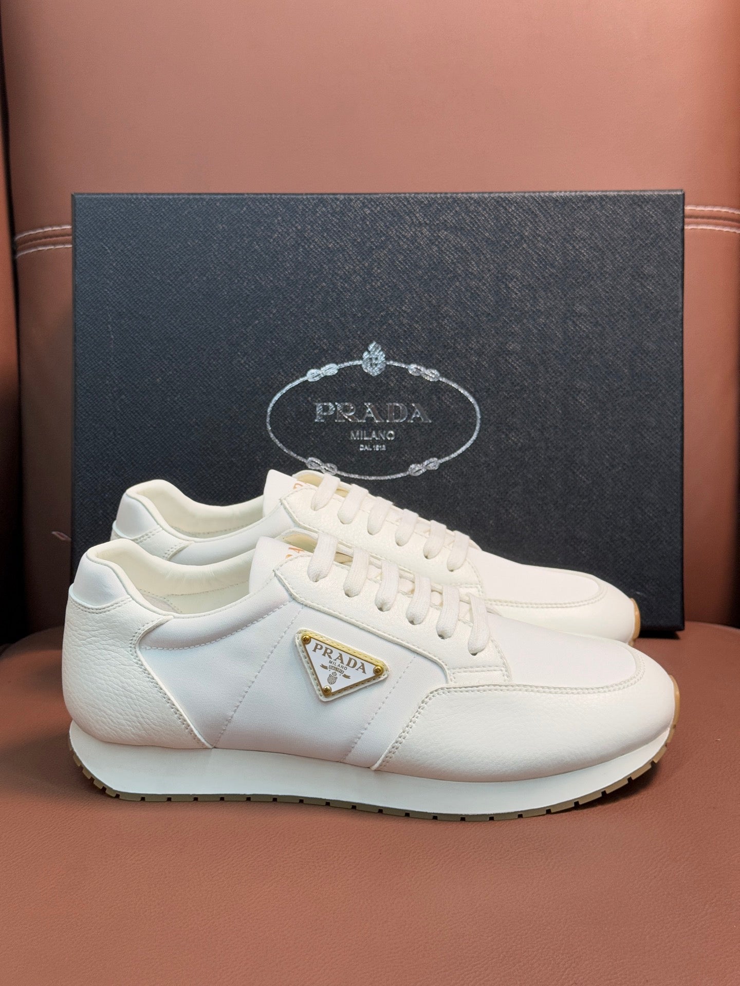 Prada unisex sneakers, white lace-up with triangular logo badge and chunky sole