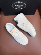 Prada unisex sneakers, white low-top lace-ups with triangular logo on sides