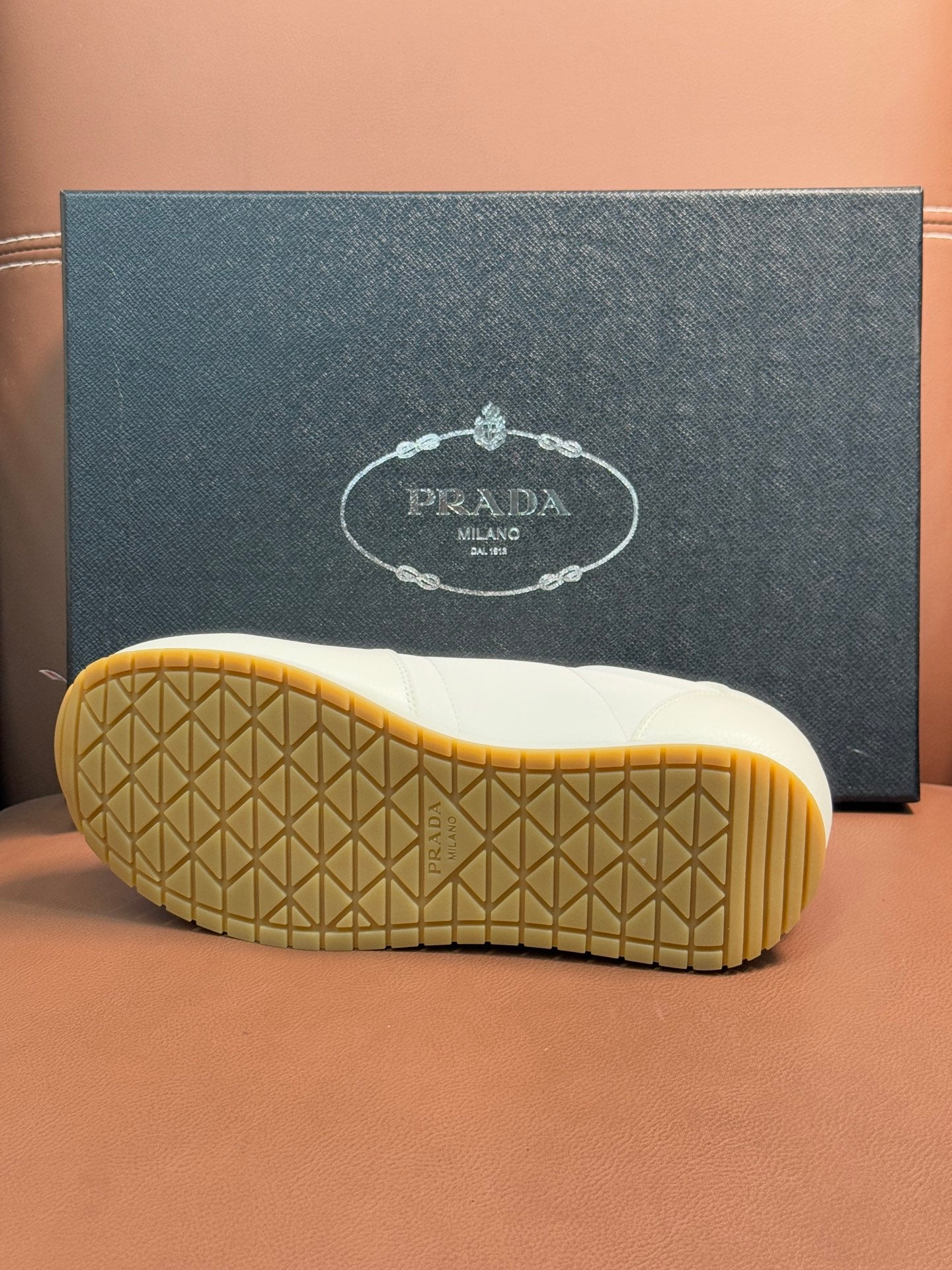 Prada unisex sneakers, tan outsole tread with geometric pattern on the heel