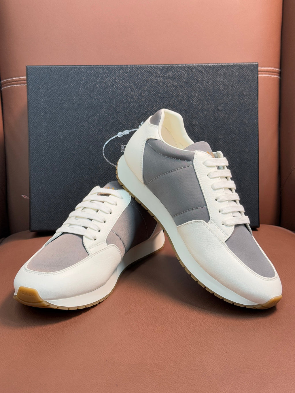 Prada unisex sneakers, white leather with gray panels and cushioned off-white sole