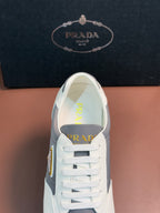 Prada unisex sneakers, front close-up with white laces and gray side panel