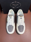 Prada unisex leather sneakers, white with gray heel panel and white laces