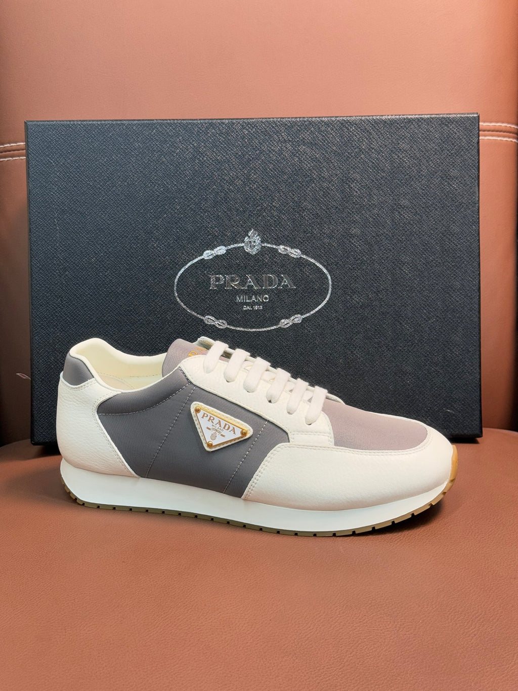 Prada unisex leather sneakers, white and gray colorblock with triangle emblem