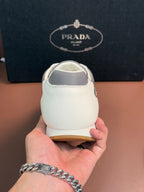 Prada unisex sneakers, back view with white leather and gray collar panel