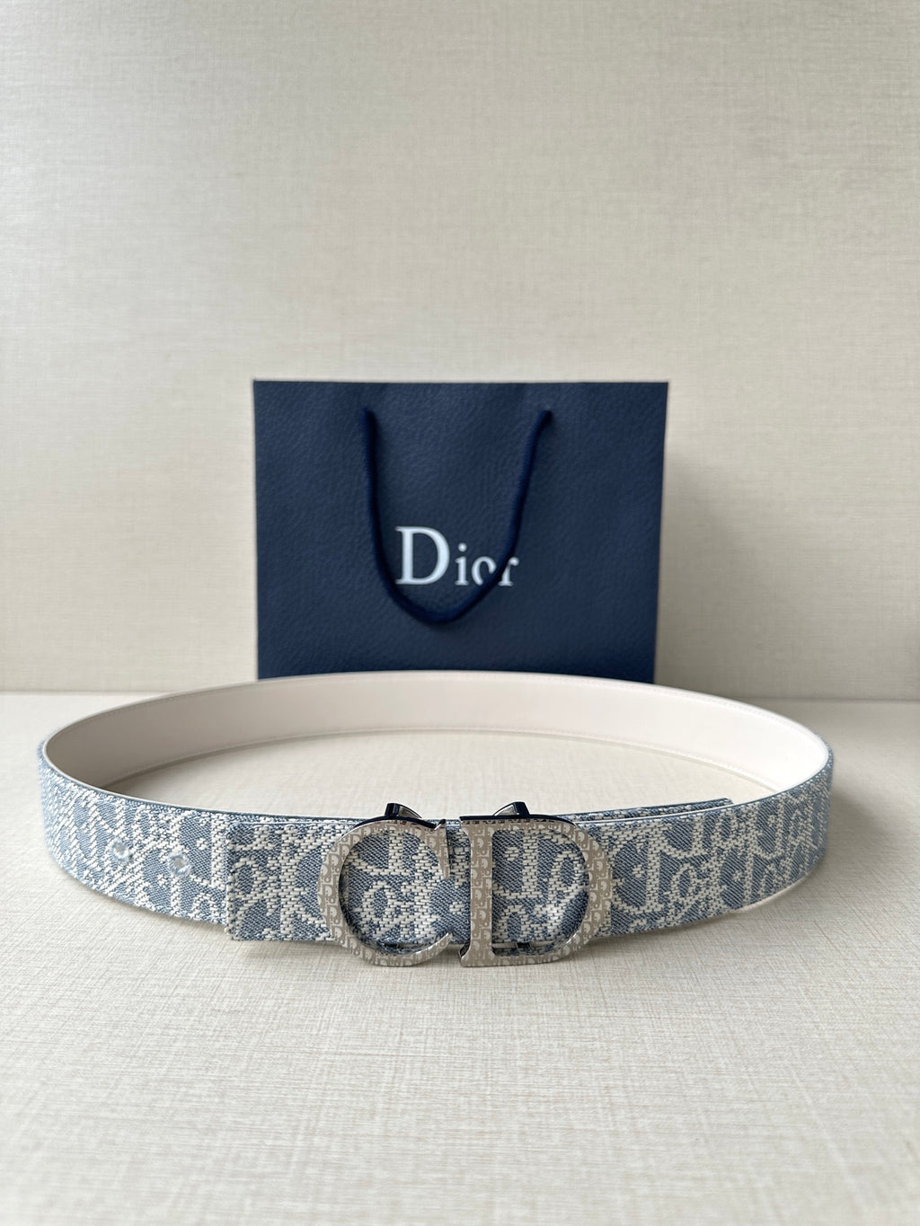 Dior logo belt with blue patterned strap and silver buckle