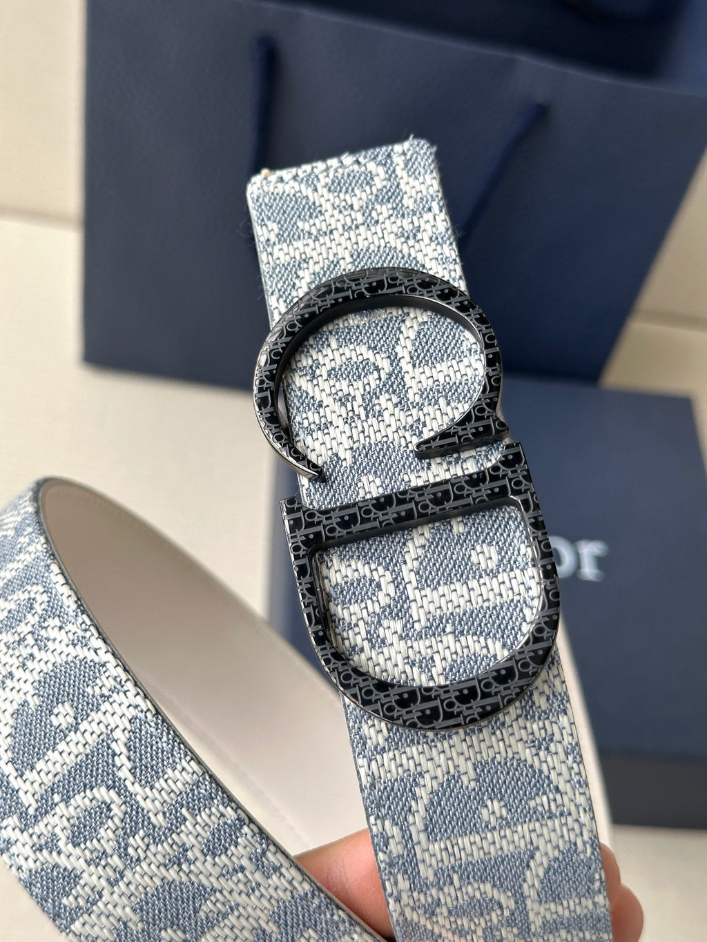 Dior logo belt with blue patterned strap and silver buckle detail