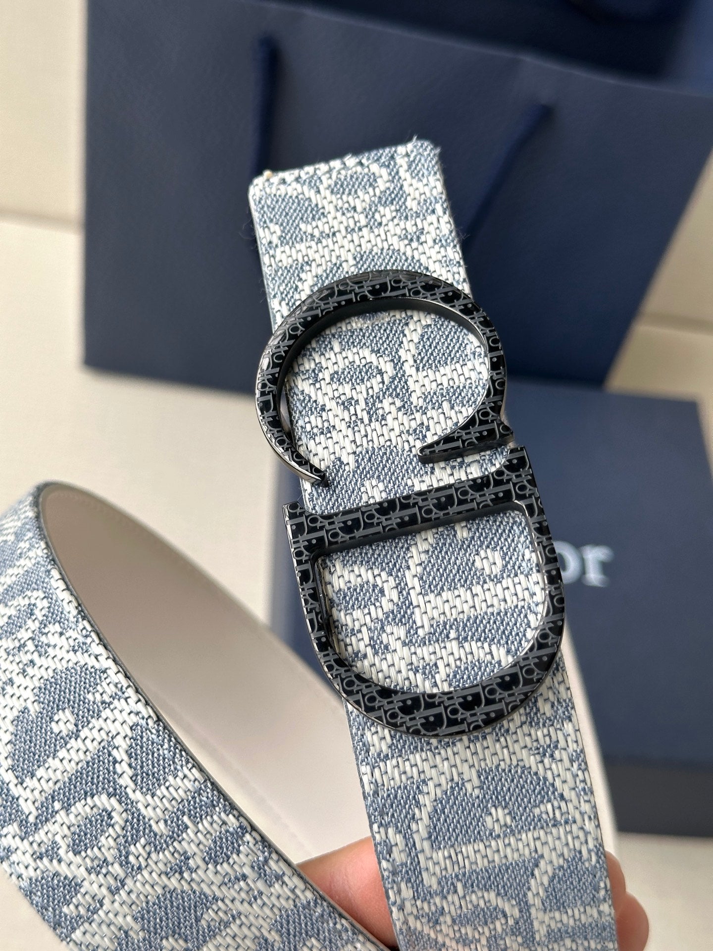 Dior logo belt with blue patterned strap and silver buckle detail