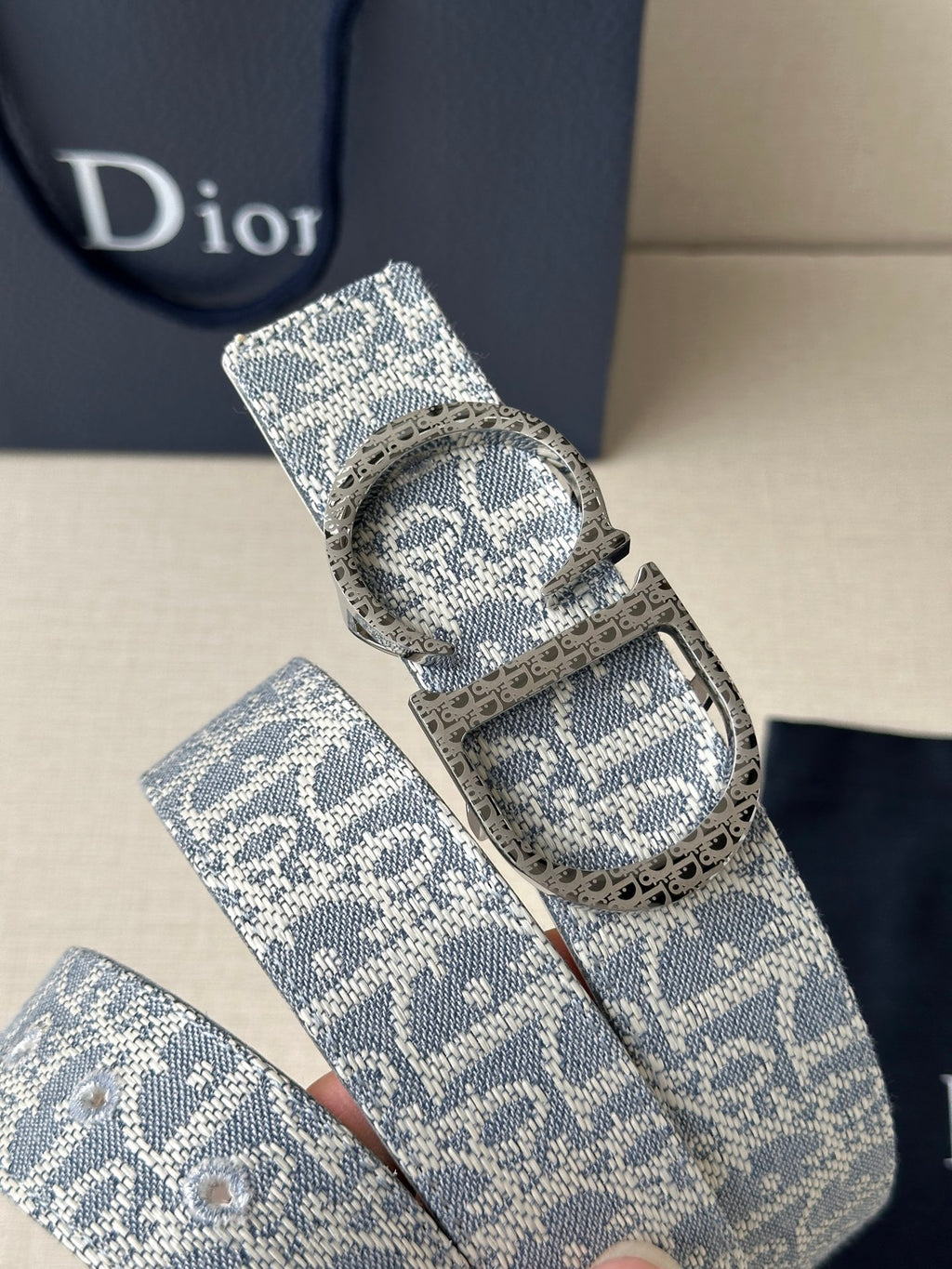 Dior logo belt with blue patterned strap and oval silver buckle