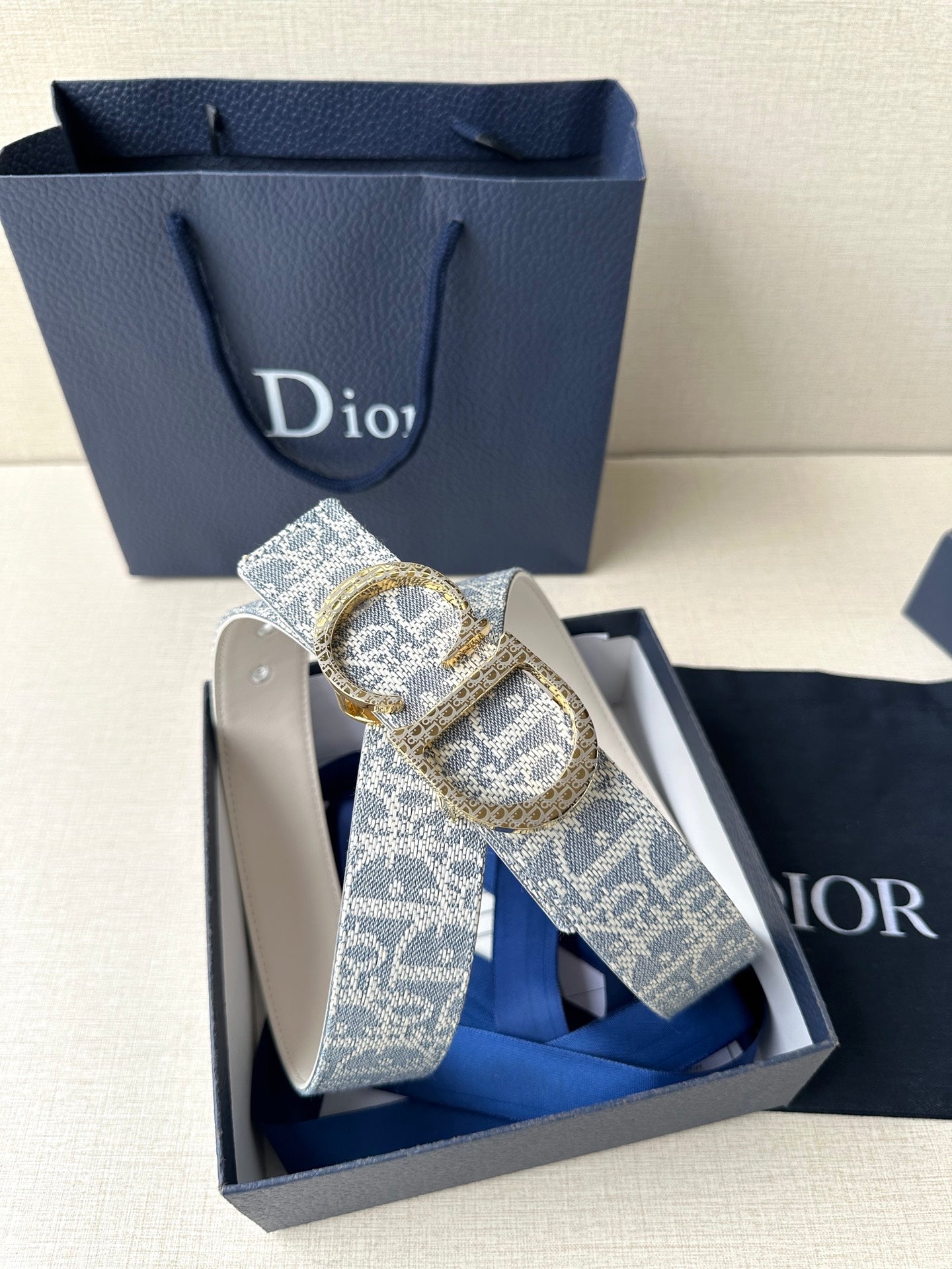 Dior logo belt with blue patterned strap and gold-tone buckle