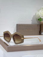 Sunglasses, beige oversized square frames with brown tinted lenses and gold temples