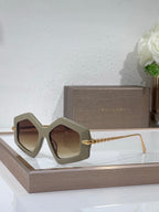 Sunglasses, light gray oversized square frames with brown tinted lenses and gold temples