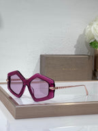 Sunglasses, magenta oversized square frames with pink tinted lenses and gold temples