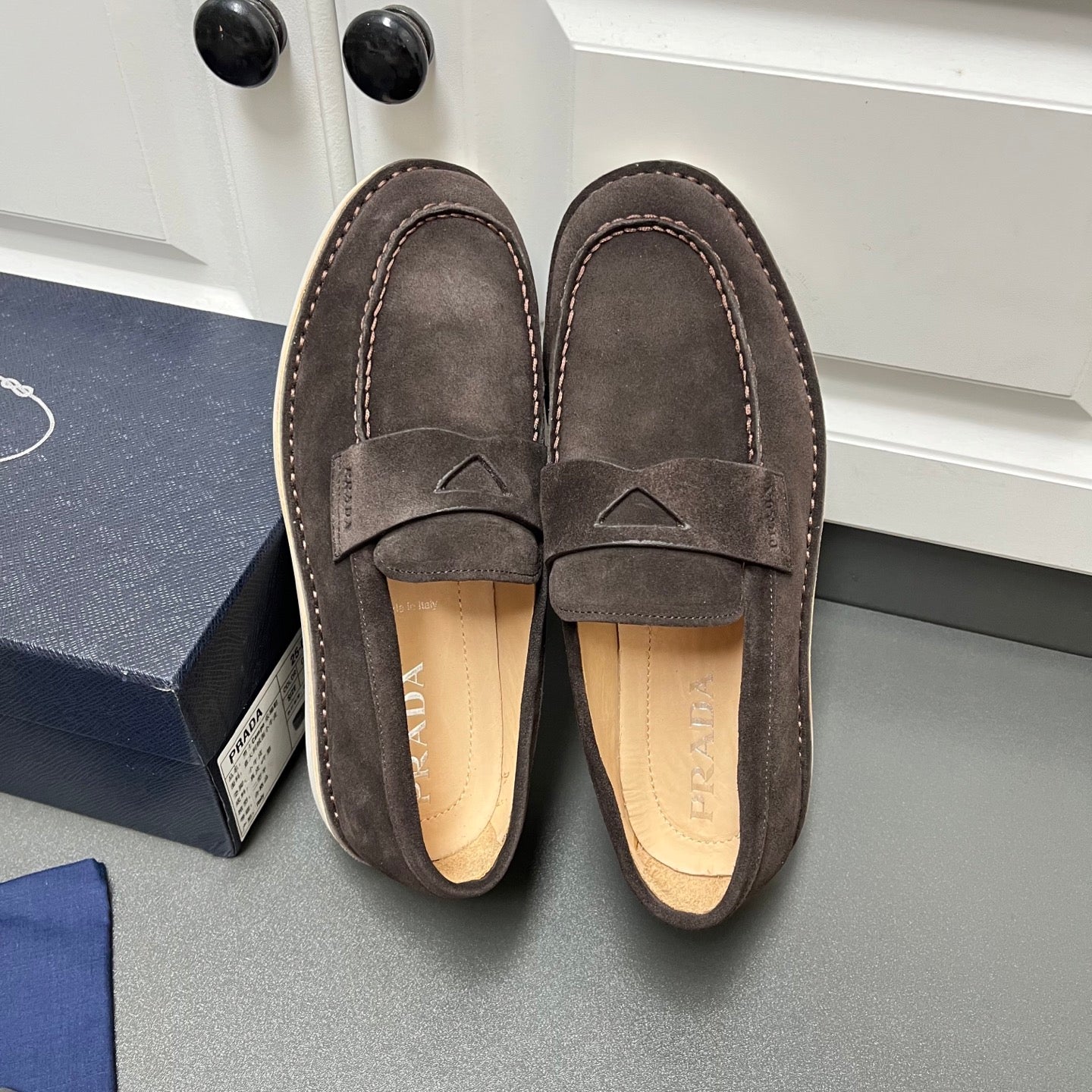 Prada unisex suede loafers, dark brown with slip-on strap and scalloped toe stitching