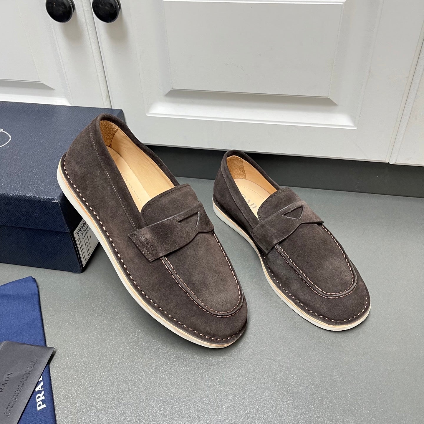 Prada unisex suede loafers, dark brown with slip-on strap and contrast-stitched trim
