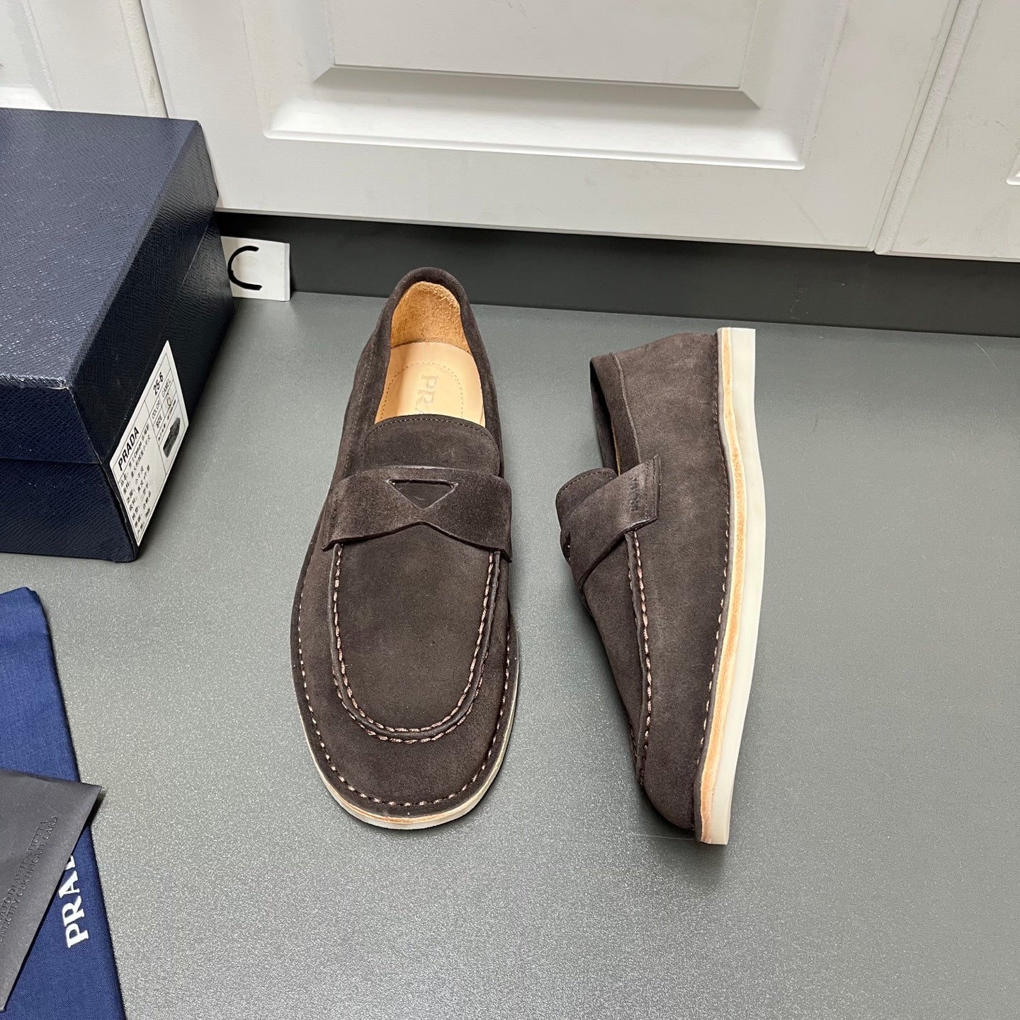 Prada unisex suede loafers, dark brown with slip-on strap and contrast stitching