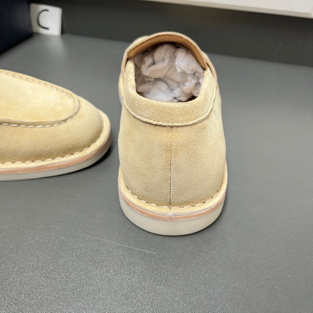 Beige Prada unisex loafer heel close-up with sock liner visible inside