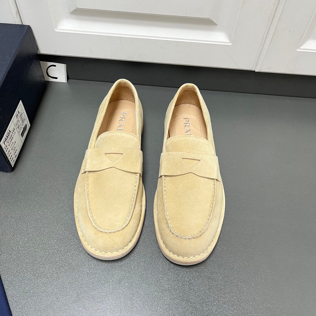 Beige Prada unisex loafers with top strap and moc toe stitching