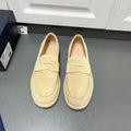 Beige Prada unisex loafers with top strap and moc toe stitching