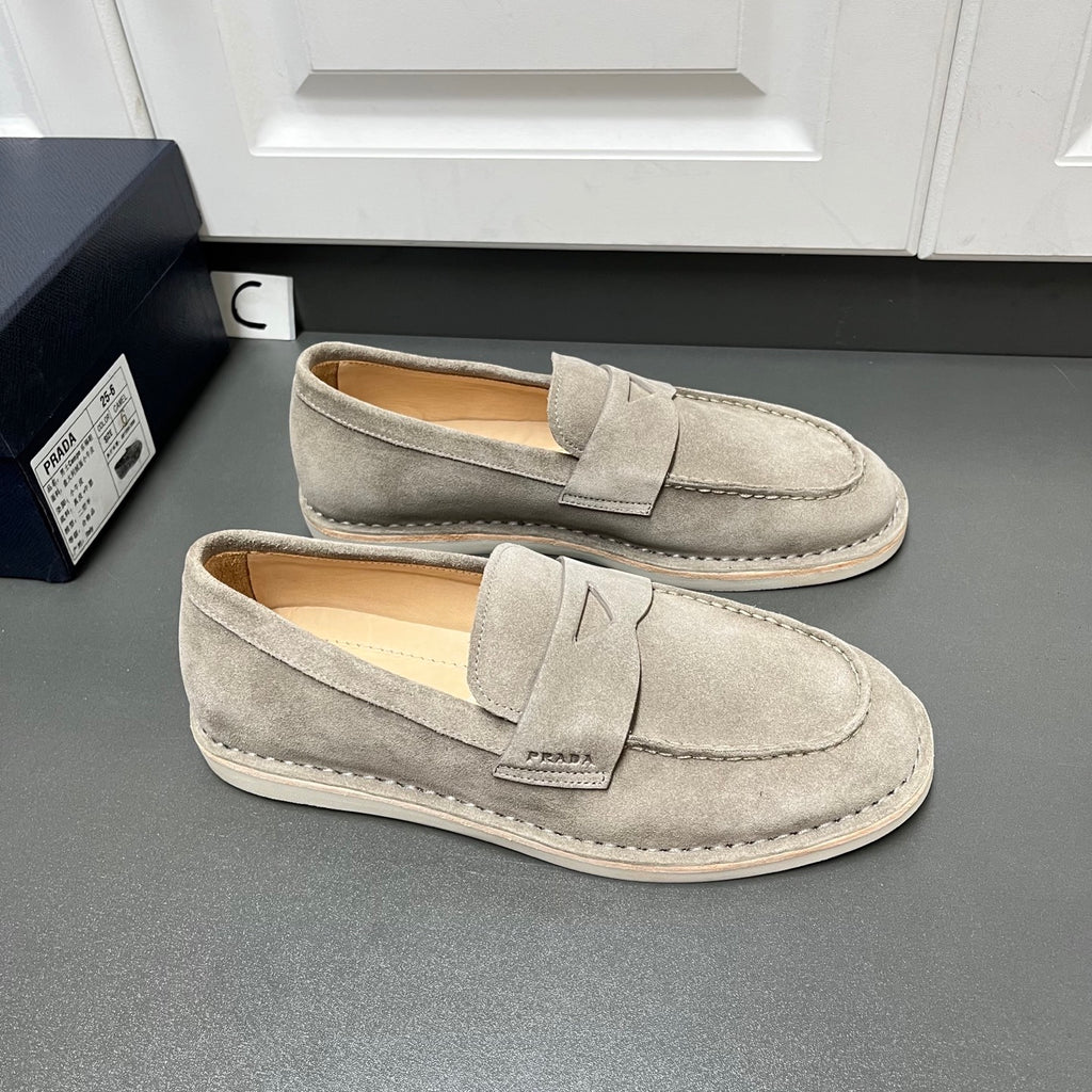 Prada unisex suede loafers, light gray slip-ons with strap detail and stitched welt