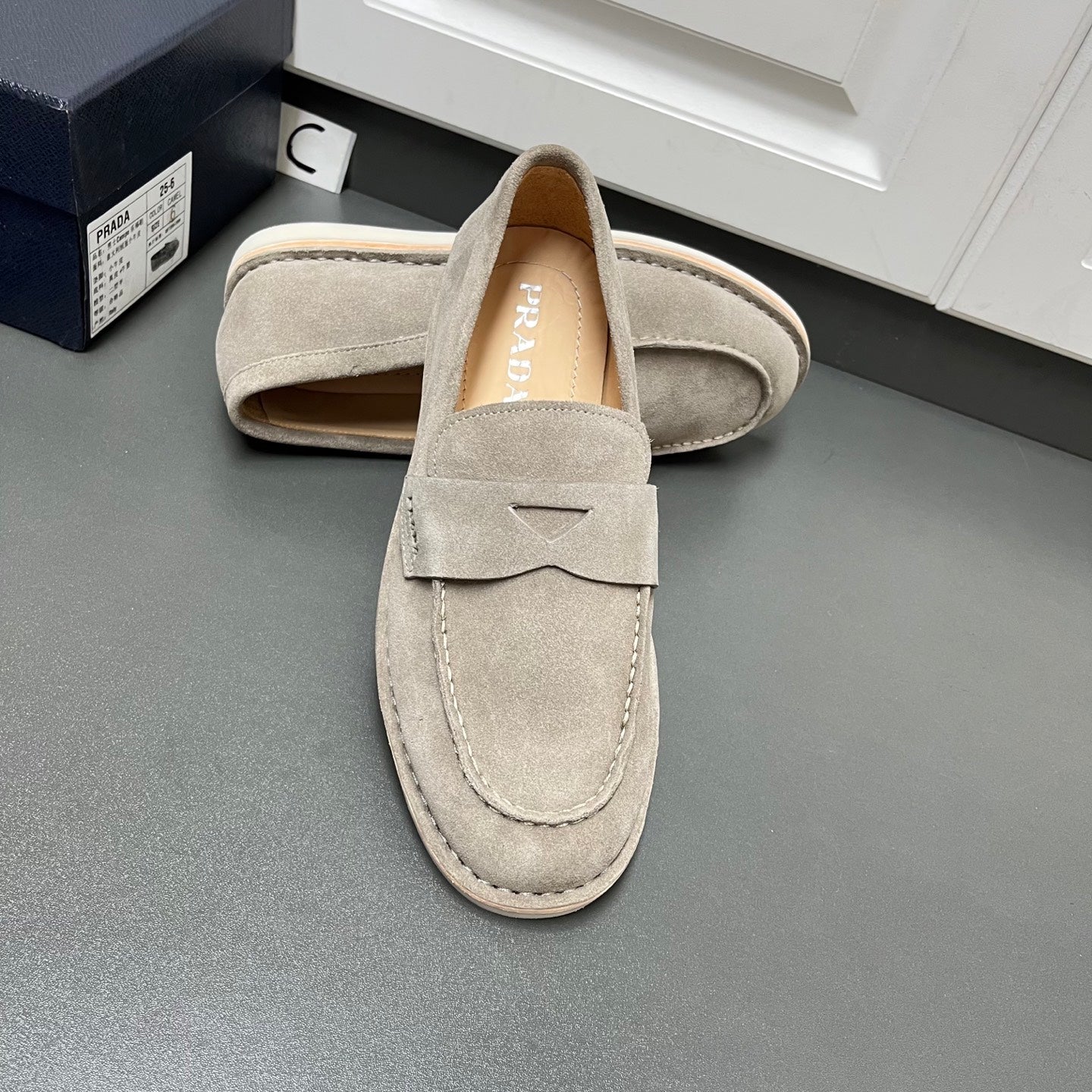 Prada unisex suede loafers, light gray with strap detail and padded collar