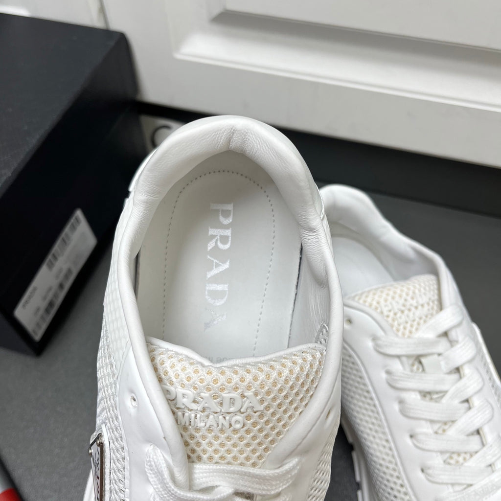 White Prada sneakers with padded collar and mesh insole lining