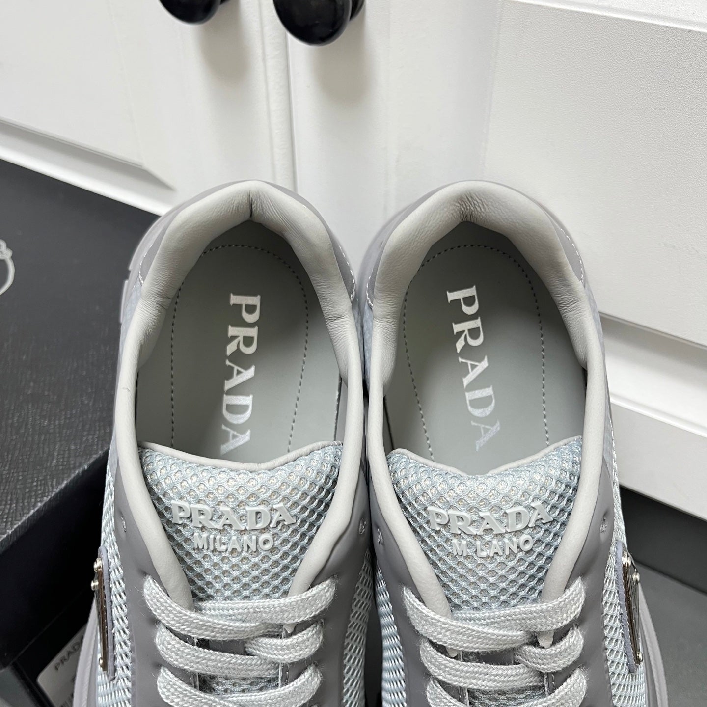 Prada unisex sneakers, light gray mesh with PRADA text on the inner tongue
