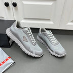 Prada unisex sneakers side view, light gray mesh with lace-up and tread sole