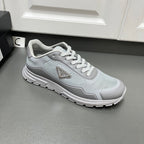 Prada unisex sneakers, light gray lace-up with textured panel and chunky white sole