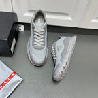 Prada unisex sneakers in light gray with mesh upper and white laces