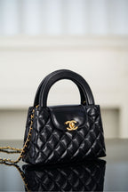 Black Chanel quilted mini handbag with CC logo medallion and chain strap