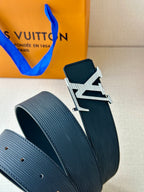 Louis Vuitton belt with LV emblem buckle and ribbed dark blue strap texture
