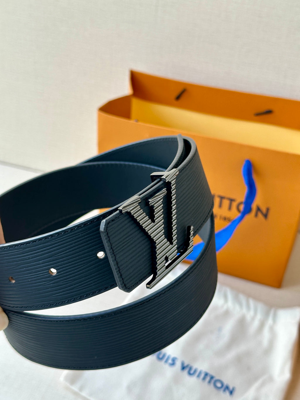 Louis Vuitton belt with LV buckle and dark blue ribbed strap