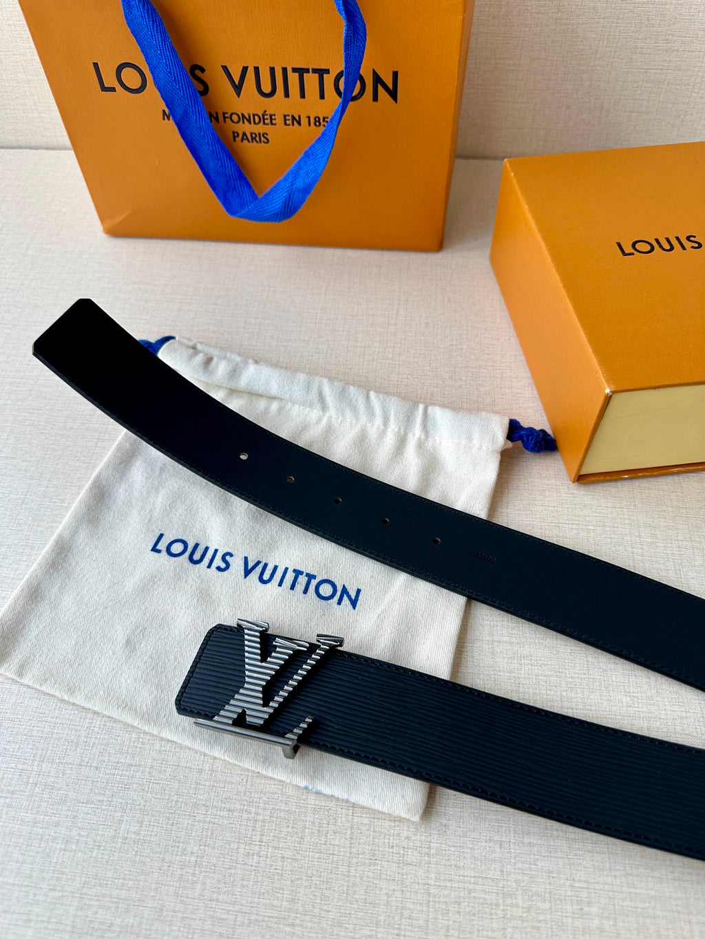 Louis Vuitton belt with LV logo buckle on dark blue strap