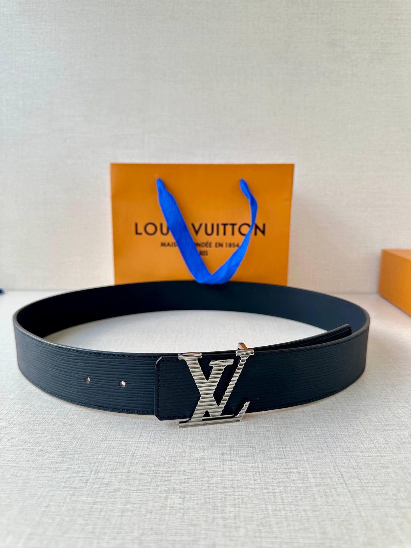 Louis Vuitton belt in dark blue with silver-toned LV buckle