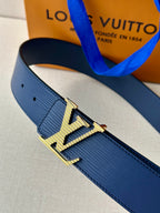 Blue leather belt showing gold-tone LV buckle detail and textured strap surface